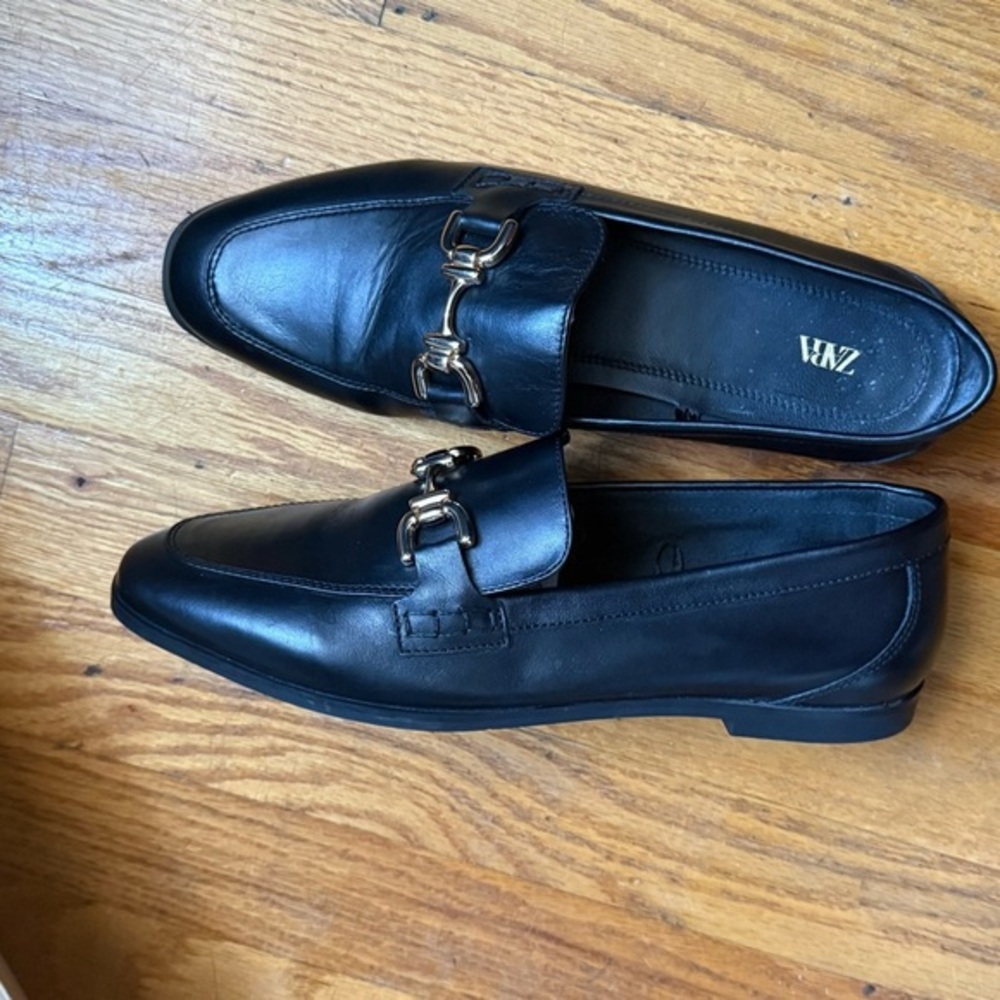 Zara Black Leather Slip on Loafers with Gold Horsebit Buckle Trim.